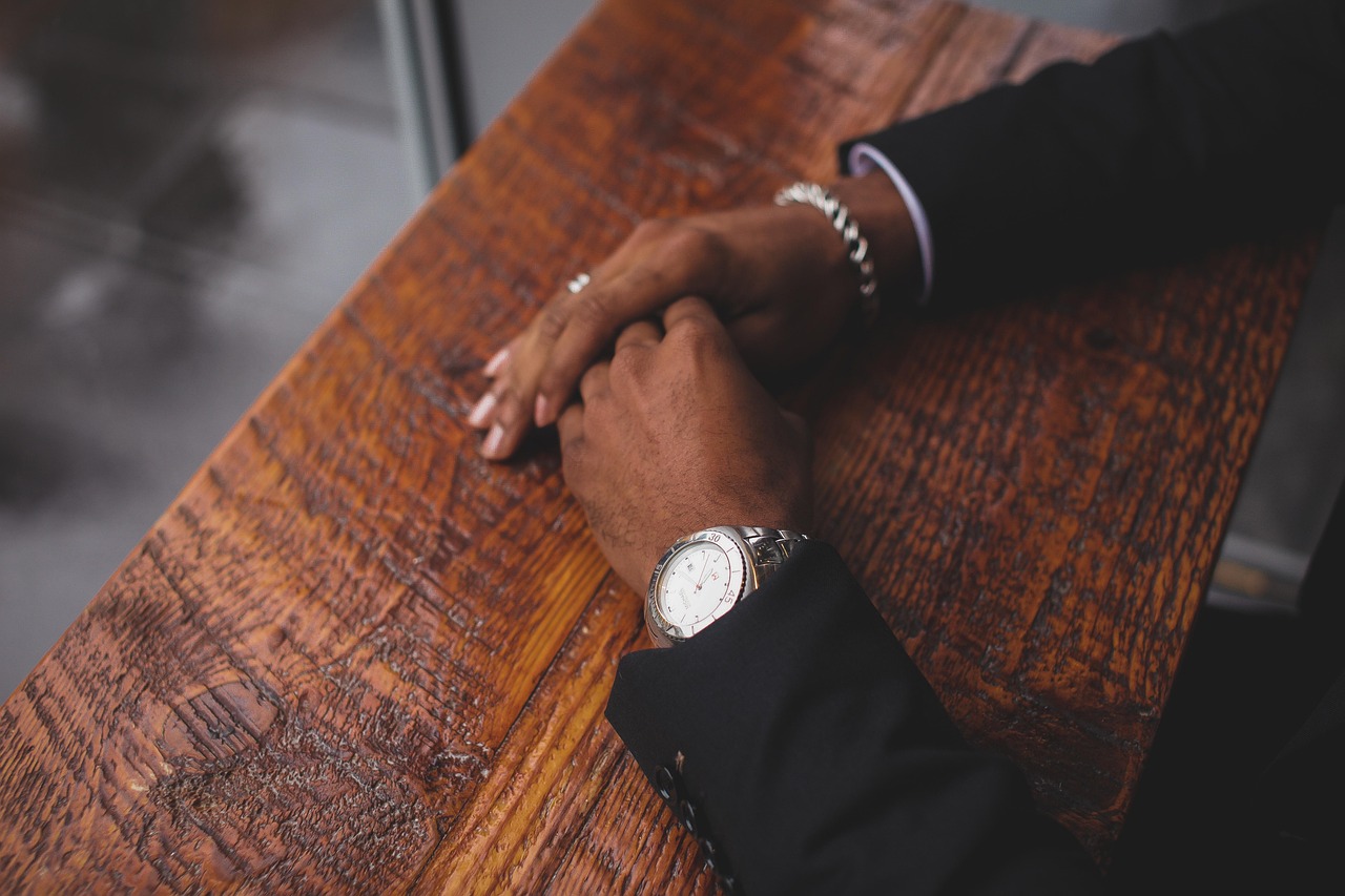 Business, hands, wristwatch — Different styles used in the activity of fishing