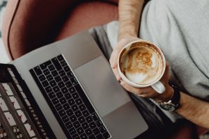 Coffee, cup, computer — Why Your Office Should Use a Water Delivery Service