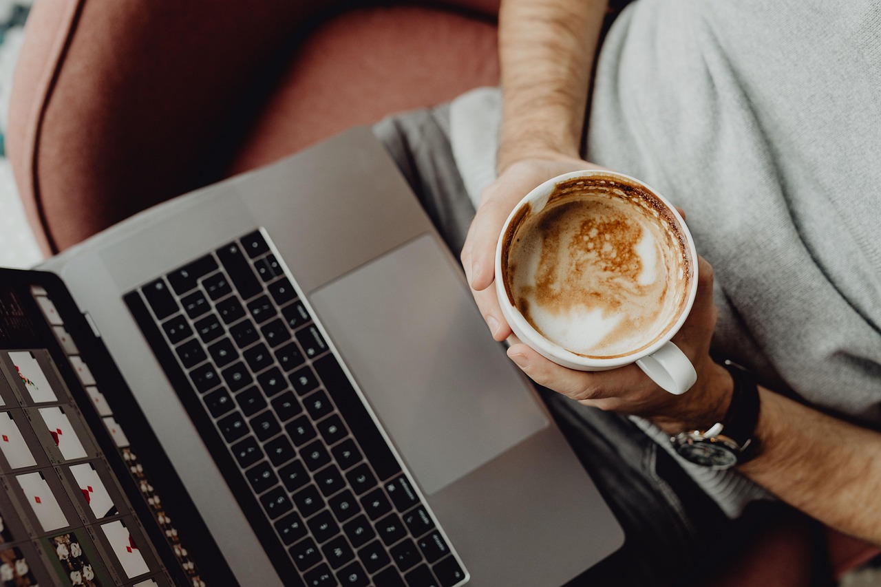 Coffee, cup, computer — Why Your Office Should Use a Water Delivery Service